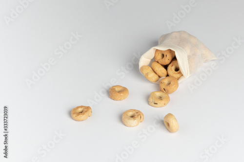 A delicious snack and a nearby ecological bag are scattered. No waste. On white background.