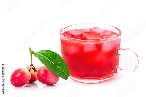 Carissa carandas or  Bengal currants fruits and glass of juice isolated on white.