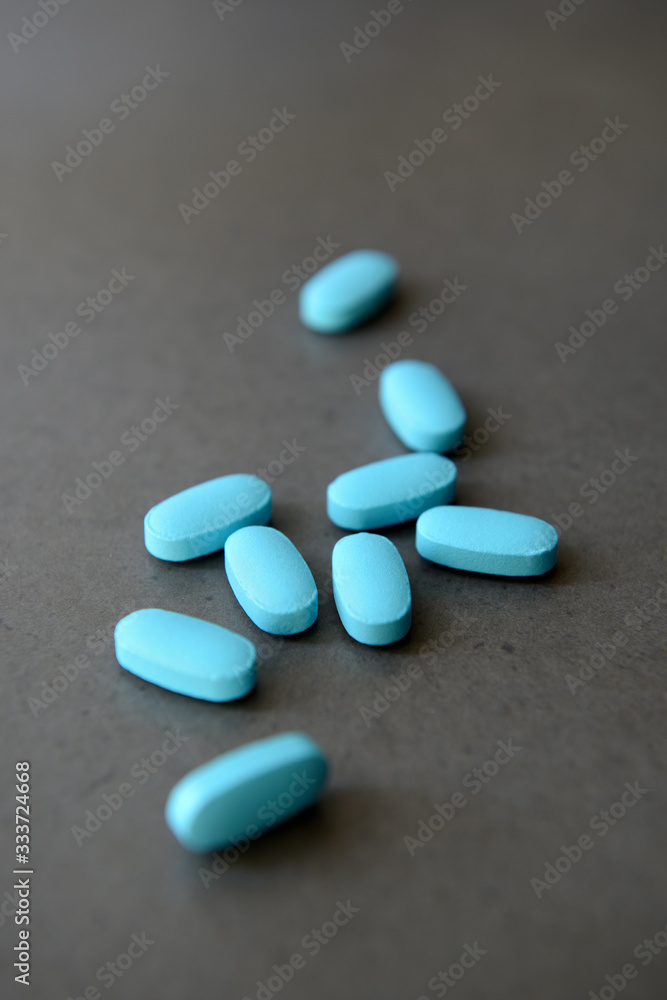 Pharmaceutical medicine pills over dark background