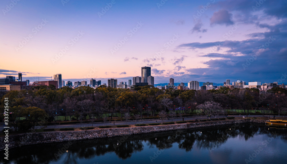 Osaka, Japan - January 07, 2020: Panoramic View to the Evening City from the Castle Roof