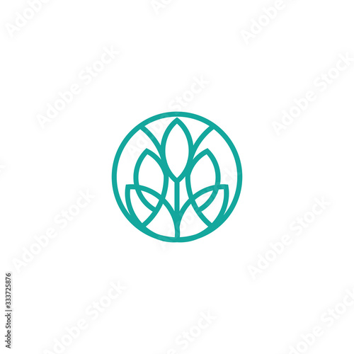 Vector logo design template and emblem made with leaves and flower - badge for yoga studios, holistic medicine centers, natural cosmetics, handcrafted jewelry and organic food products