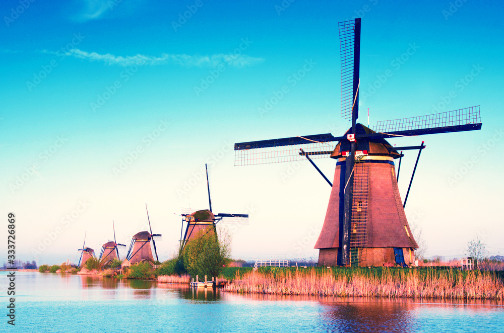 breathtaking beautiful inspirational landscape with windmills in Kinderdijk, Netherlands. Fascinating places, tourist attraction.