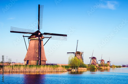 Obraz na płótnie breathtaking beautiful inspirational landscape with windmills in Kinderdijk, Netherlands. Fascinating places, tourist attraction. w salonie