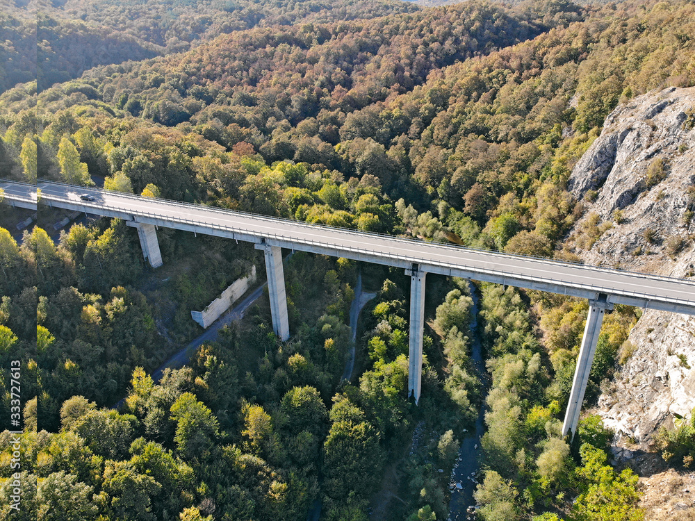 Created by dji camera. An automobile bridge on high pylons through a deep gorge in the mountains. Created by dji camera. An automobile bridge on high pylons through a deep gorge in the mountains.