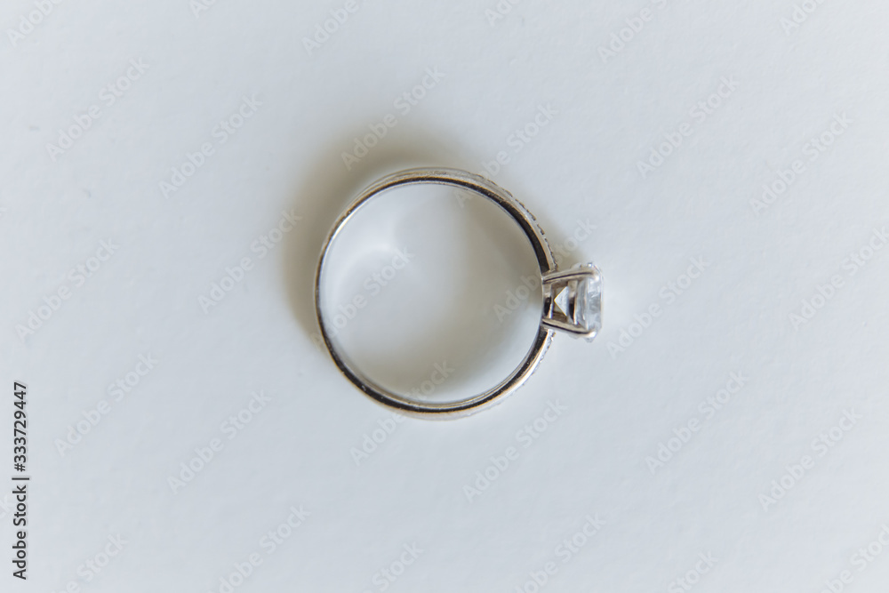 silver ring with a stone diamond top view on a white background silver ring with a stone diamond top view on a white background
