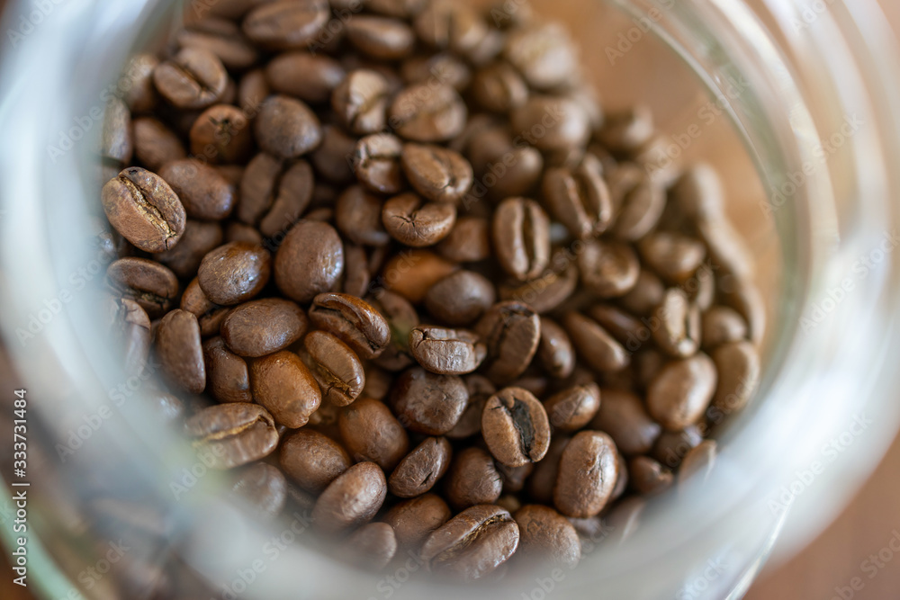 Fototapeta premium Roasted coffee beans in the glass mug
