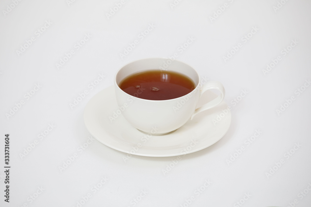 white cup with tea on a white background