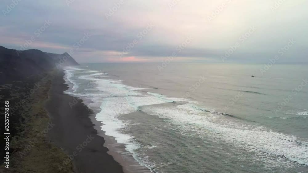 Waves moving in and out of the sand viewed form above on a sunny day showing a different perspective and feelings of peace and tranquility Waves moving in and out of the sand viewed form above on a sunny day showing a different perspective and feelings of peace and tranquility
