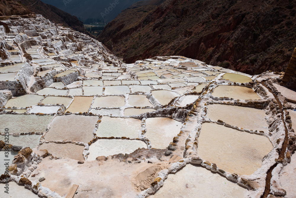 Fototapeta premium Salt evaporation ponds in the town of Maras in the Sacred Valley near Cusco, Peru