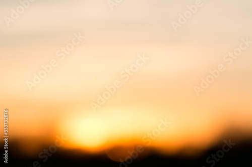 Fototapeta Naklejka Na Ścianę i Meble -  Beautiful bokeh background of orange sunset