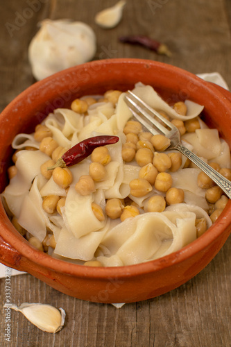Dish of Lagane with chickpeas, homemade Italian pasta, typical food from the Calabria.
