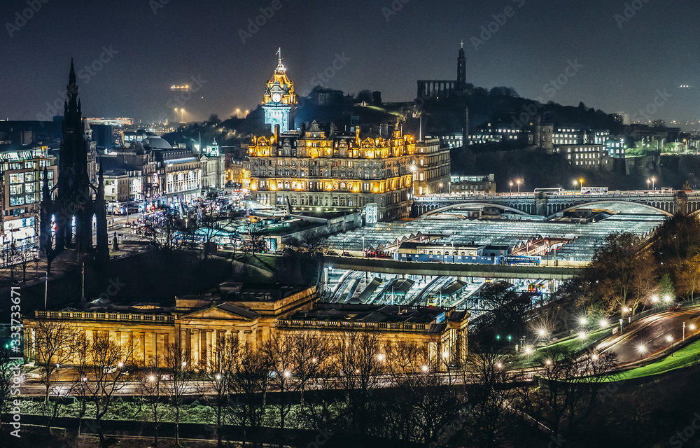Aerial view of Edinburgh with buildings of National Gallery of Scotland and Waverley Railway Station on photo, UK
