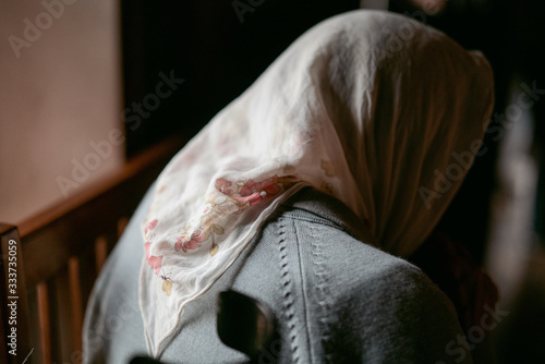 old woman in the church photo