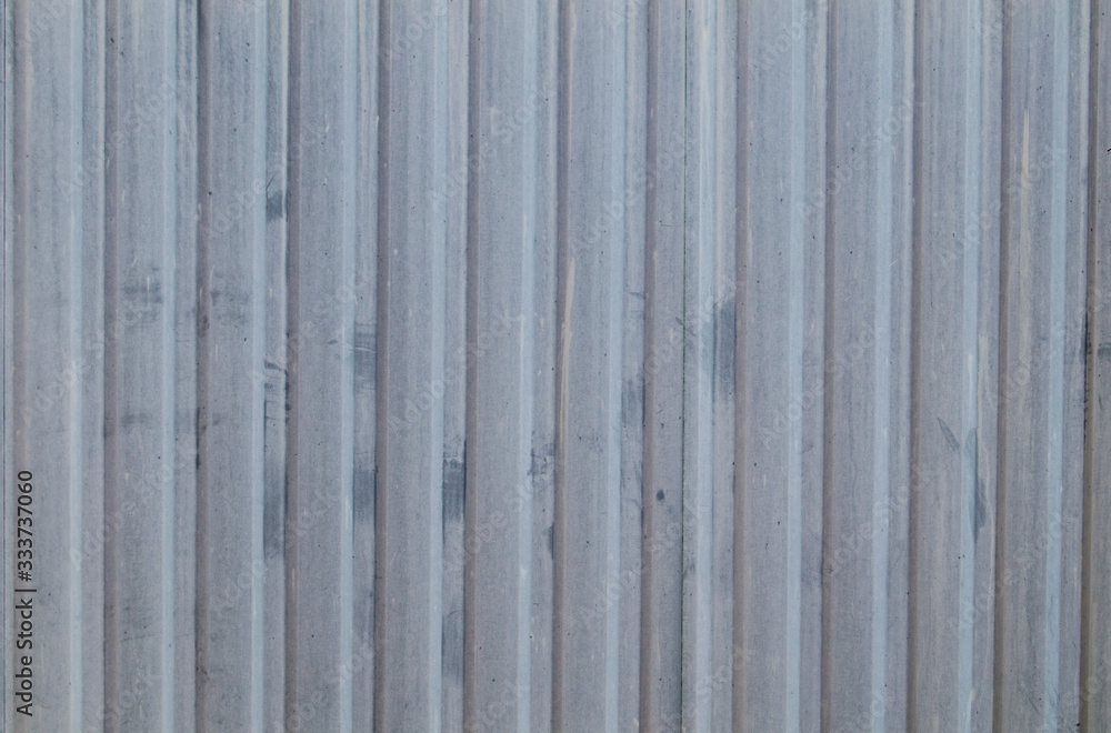 The metal sheet of the profiled sheet in the fence in white The metal sheet of the profiled sheet in the fence in white