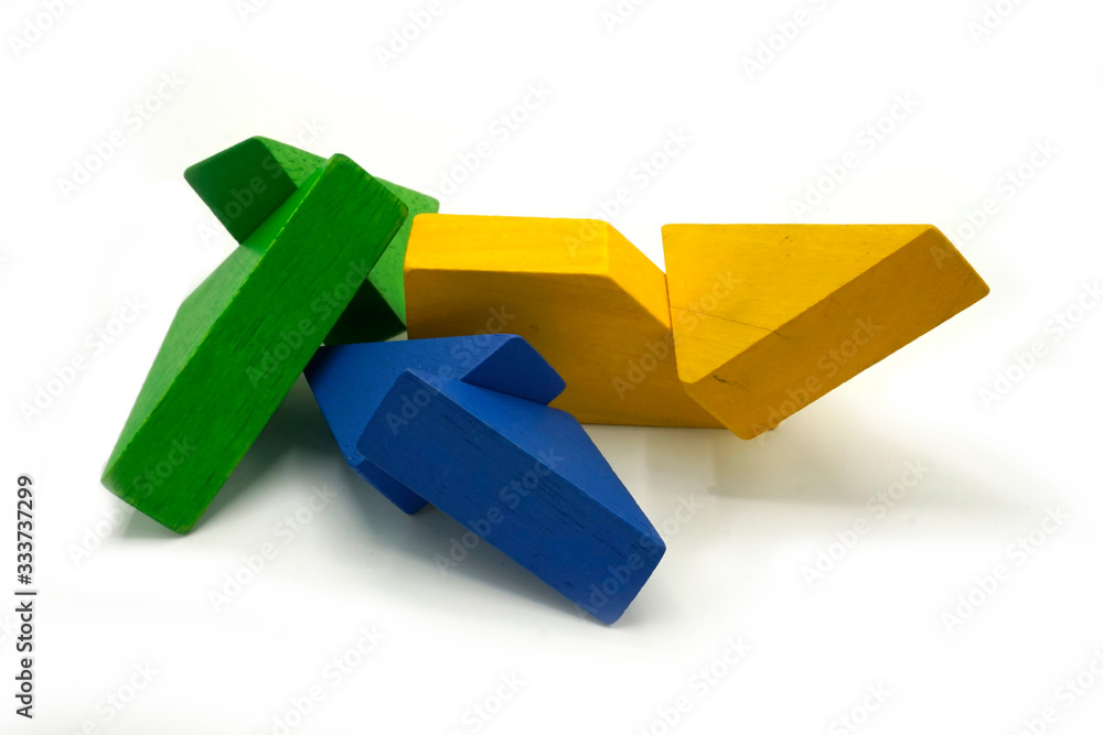Twisted colorful building blocks made of wood. Educational toy and logical puzzle. Abstract mobile structure. Twisted colorful building blocks made of wood. Educational toy and logical puzzle. Abstract mobile structure.