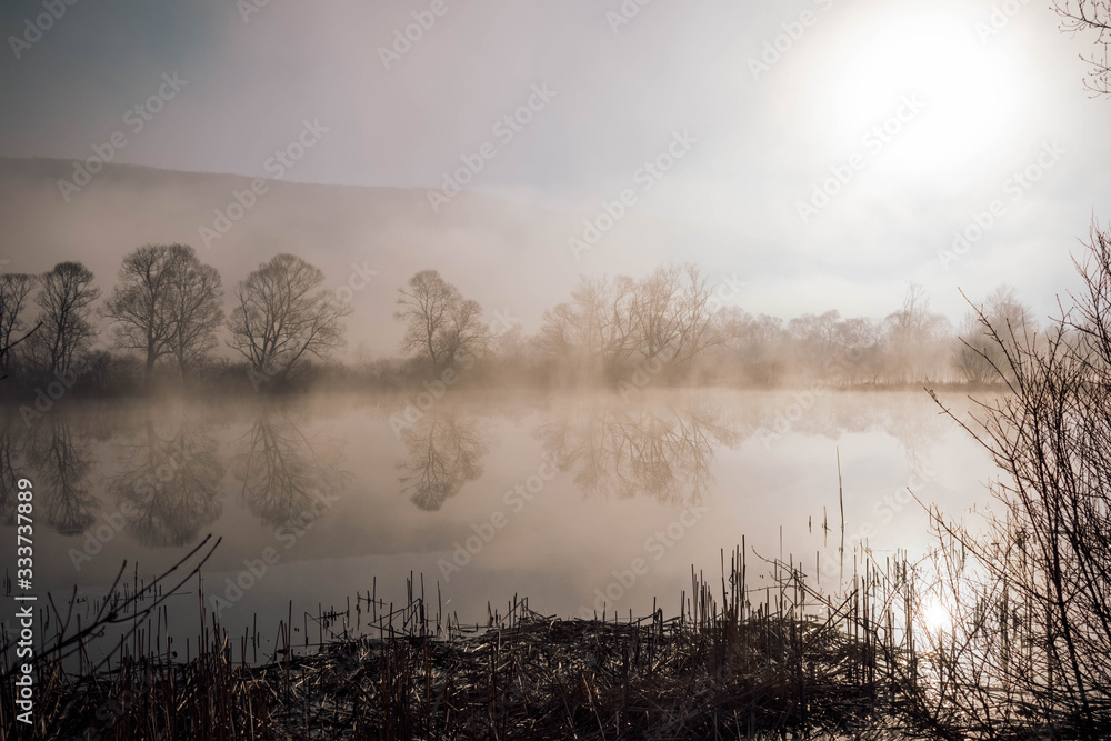 Mystical lake on a foggy morning Mystical lake on a foggy morning