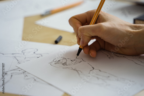 How to draw class of many figure drawing pencil and marker sketches. The artist worskspace with male and female drawings and pencils on the white paper, art, craft, creativity, inspiration, concepts