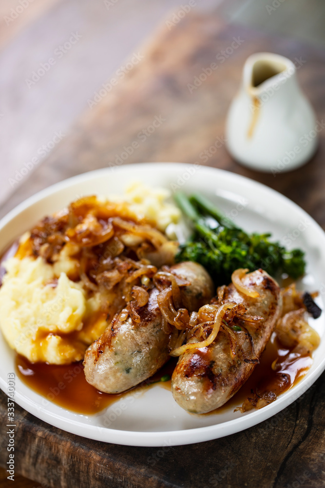 Sausages with fried onions and mashed potatoes Sausages with fried onions and mashed potatoes