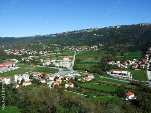 View of Buzet town and fertile fields in the Mirna river valley, Croatia (Pogled na grad Buzet i plodna polja u dolini rijeke Mirne, Hrvatska) photo