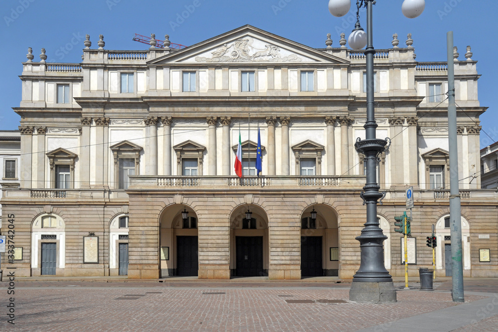 Europe, Italy, Milan March 2020 - completely deserted places of tourist interest, without people, for n-cov19 Coronavirus pandemic - Piazza della Scala - Scala theater