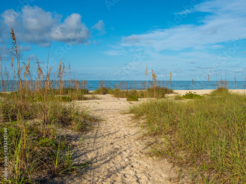 Sandy path to Nokomis Beach on Gulf of Mexico in early morning light on Casey Key in Nokomis Florida in the United States