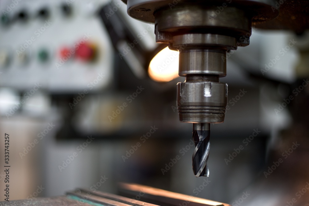 Abandoned machine metalworking lathe in a factory closing due to the pandemic virus Abandoned machine metalworking lathe in a factory closing due to the pandemic virus