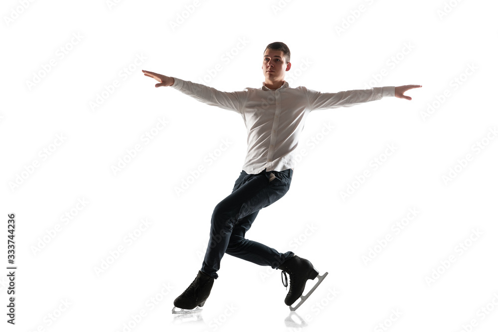 Man figure skating isolated on white studio backgound with copyspace. Professional practicing and training in action and motion on ice. Graceful and weightless. Concept of movement, sport, beauty. Man figure skating isolated on white studio backgound with copyspace. Professional practicing and training in action and motion on ice. Graceful and weightless. Concept of movement, sport, beauty.