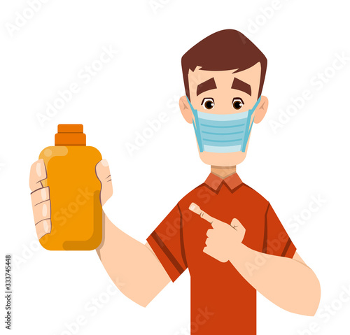 handsome man holding and showing sanitizer gel bottle