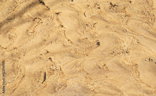 Sand under water, view from above