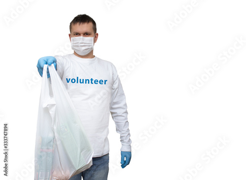 A volunteer carrying basic necessities for senior citizens in Europe. The city is under quarantine due to Covid-19 flu infection.