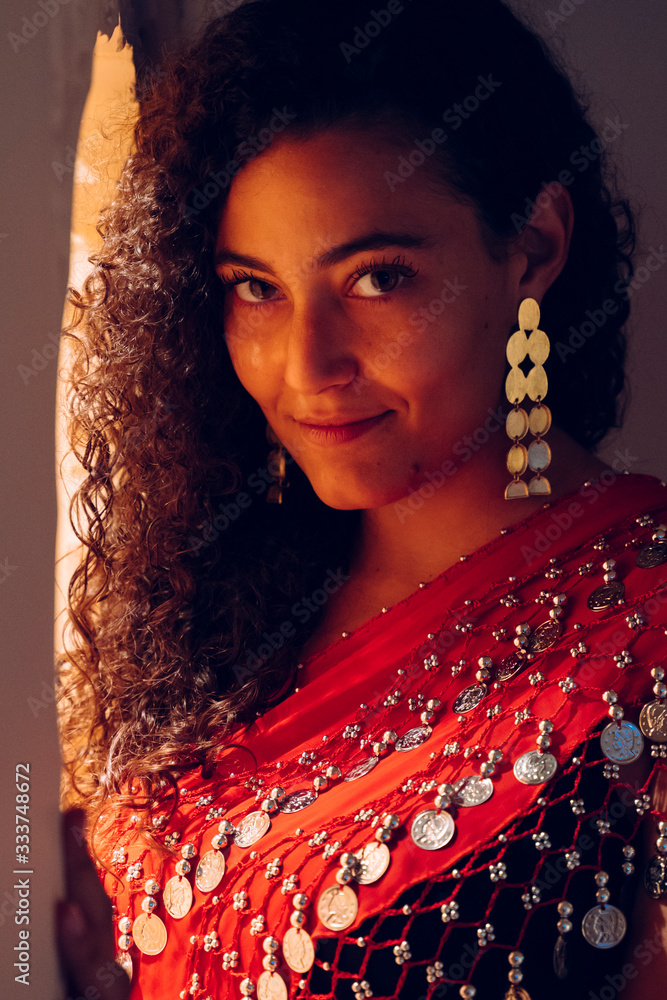Portrait of beautiful ethnic arab woman in moroccan hotel. Isolated ...