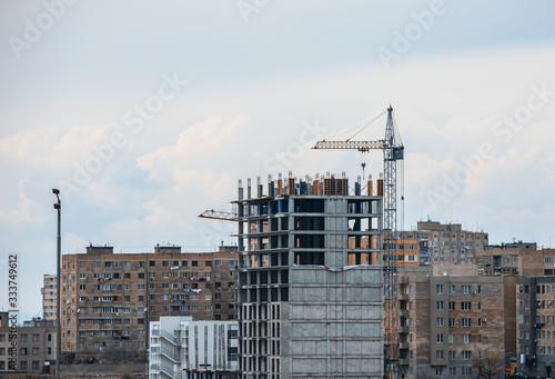 crane against a new block of flats