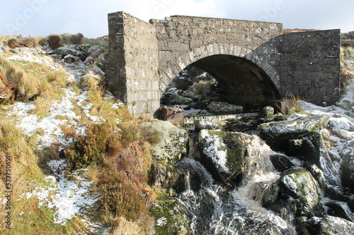 Ancient bridge in a cold and snowy landscape