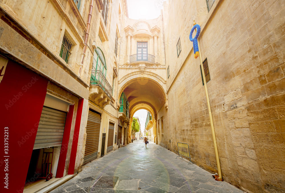 Road between old building in Valletta, Malta