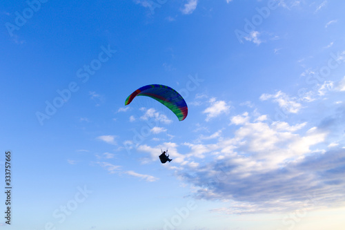 paragliding in the blue sky