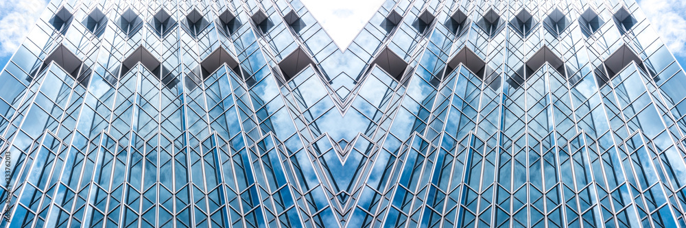 Obraz premium underside panoramic and perspective view to steel blue glass high rise building skyscrapers, business concept of successful industrial architecture