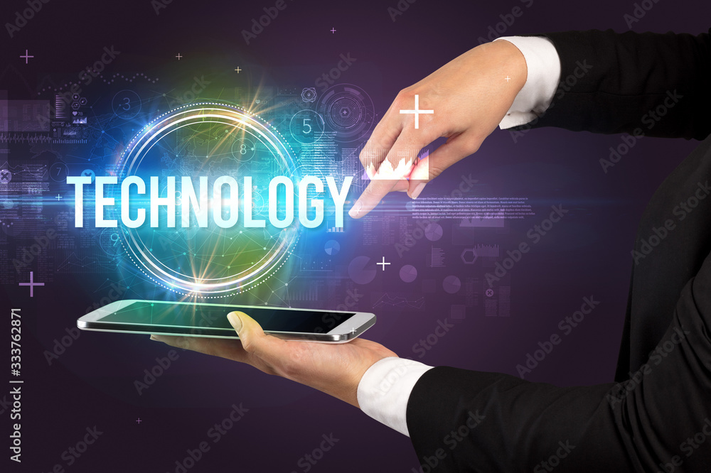 Close-up of a touchscreen with TECHNOLOGY inscription, new technology concept Close-up of a touchscreen with TECHNOLOGY inscription, new technology concept