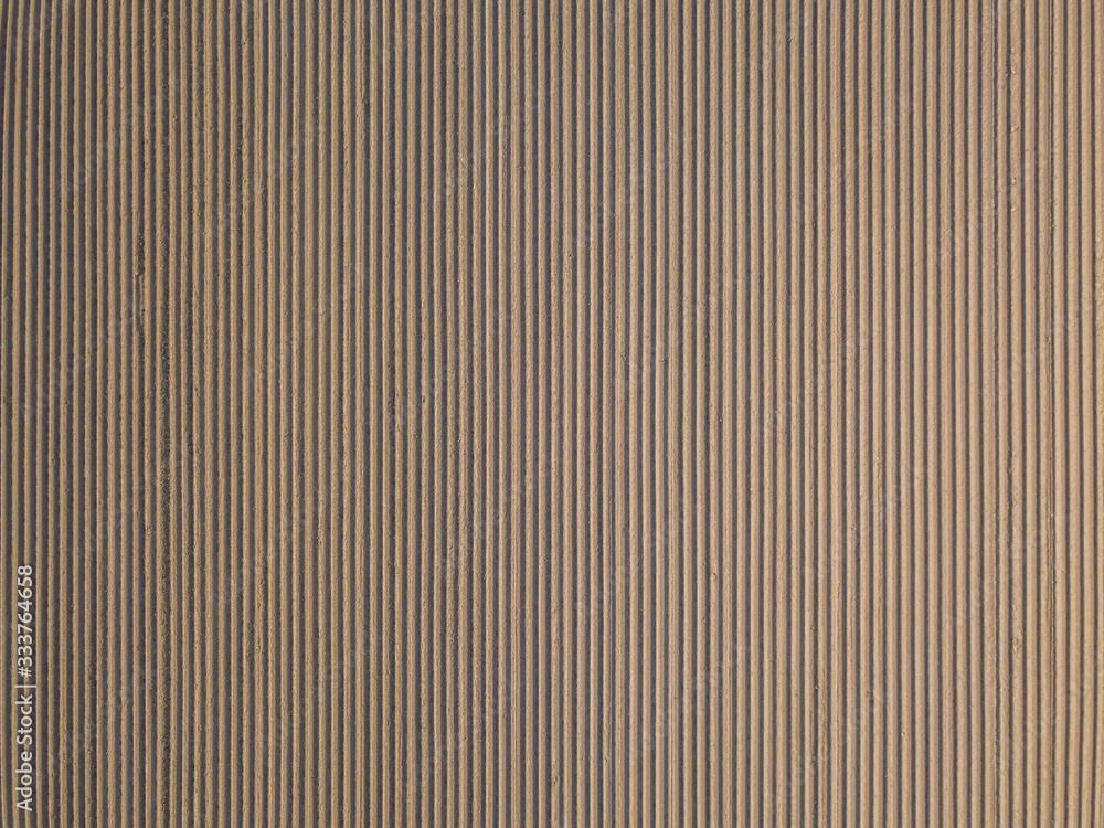 Obraz premium Aerial view of rows on potato farmland field. Concept of modern agriculture.