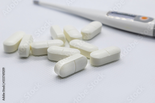 White long health drug pills on white background