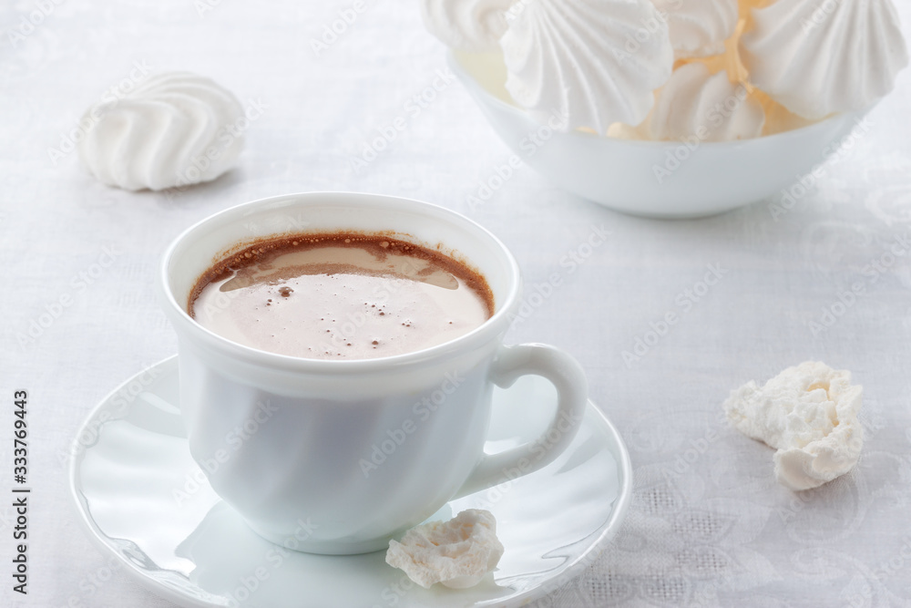 A cup of fresh coffee with cream and a gentle, airy Bizet A cup of fresh coffee with cream and a gentle, airy Bizet