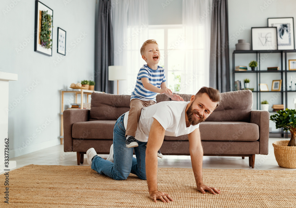 Father and little son having fun at home - obrazy, fototapety, plakaty 