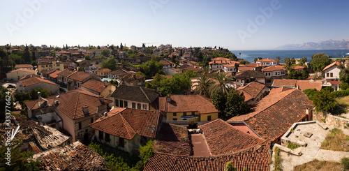 Red tile roofs of the Antalya Old Town with see in the background, Turkey, in April