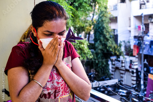 Mature woman in medical mask staying at home under quarantine - stock photo, Isolation Quarantine Coronavirus Covid 19