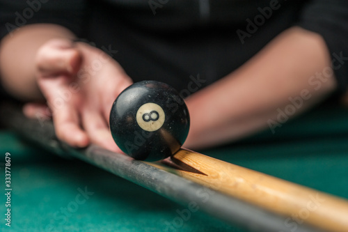 Billiards balls and cue on billiards table. Billiard sport concept