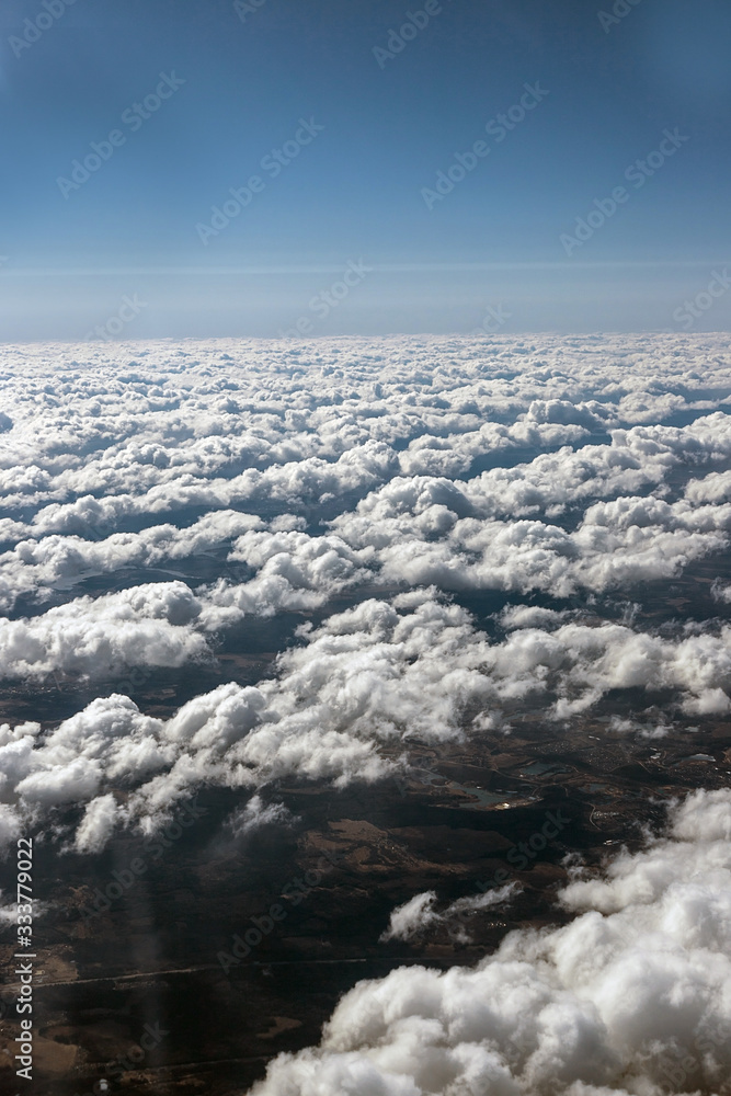 View of the clouds from the plane. Smooth bands of clouds. patterns from clouds. small clouds.