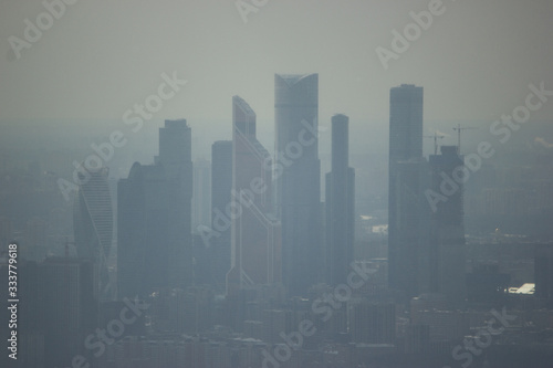 Close up of Towers of Moscow City in winter evening fog. Moscow International Business Center.