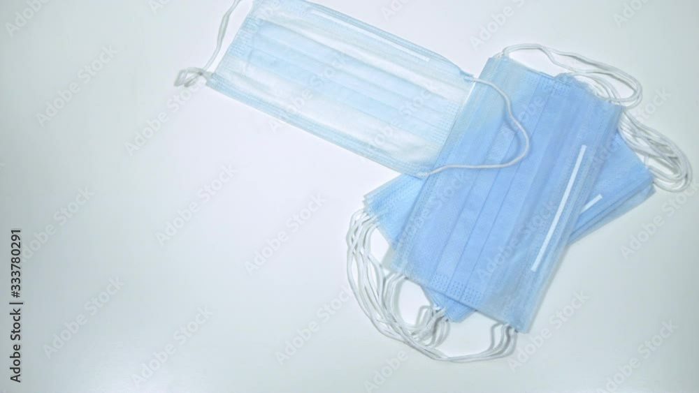 Surgical Masks Picked up by Hands in Latex Medical Gloves Surgical Masks Picked up by Hands in Latex Medical Gloves