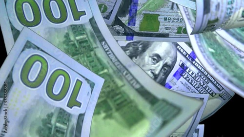 dollars are falling down on a black background close-up