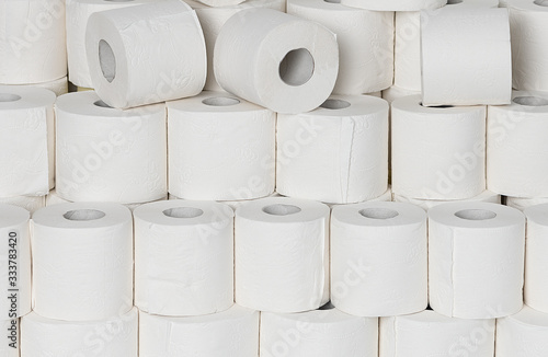 Toilet paper rools stacked on top of each other photo