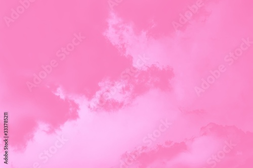 Pastel sky background. Pink sky with fluffy clouds © kvitkanastroyu
